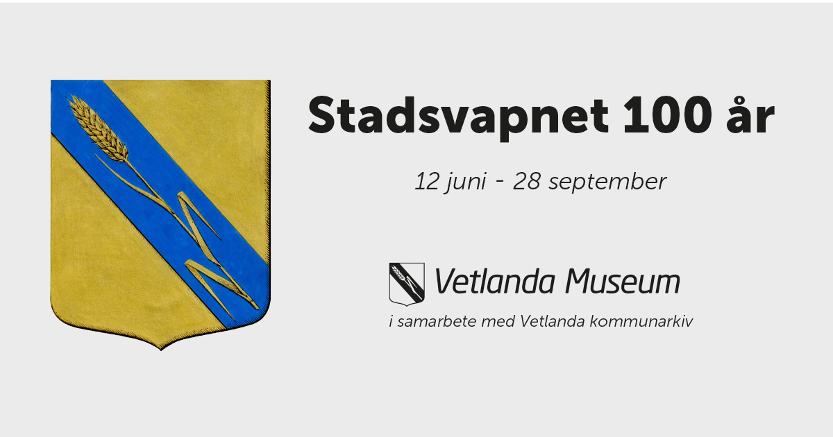 Stadsvapen med en sköld av guld med en blå snedbjälke, belagd med ett veteax av nämnda metall samt texten